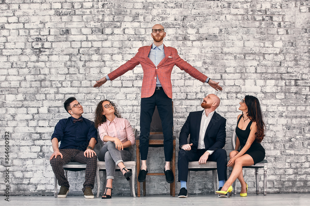 Fototapeta premium Successful team leader manager, CEO, market leader and another business leading concepts. Standing out from the crowd.