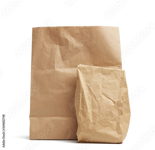 full paper disposable bag of brown kraft paper isolated on white background, concept of rejection of plastic packaging