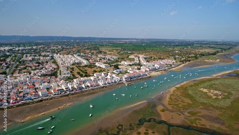Video shooting aerial, the Ria Formosa canal of the village Cabanas de Tavira. Water tourism and traditional fishing. Portugal Algatrve. Video shooting aerial, the Ria Formosa canal of the village Cabanas de Tavira. Water tourism and traditional fishing. Portugal Algatrve.