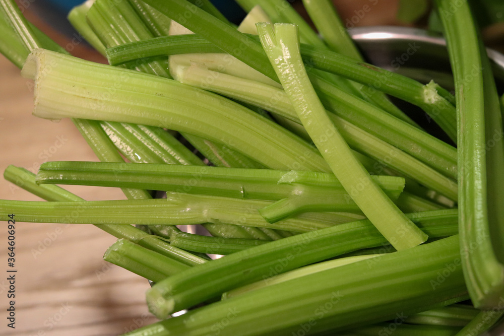 Obraz premium Celery stalks, widely used in the preparation of different dishes.