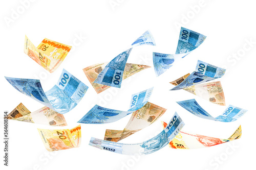 twenty, fifty and one hundred reais bills falling, money from Brazil on isolated white background. Money slowly falling