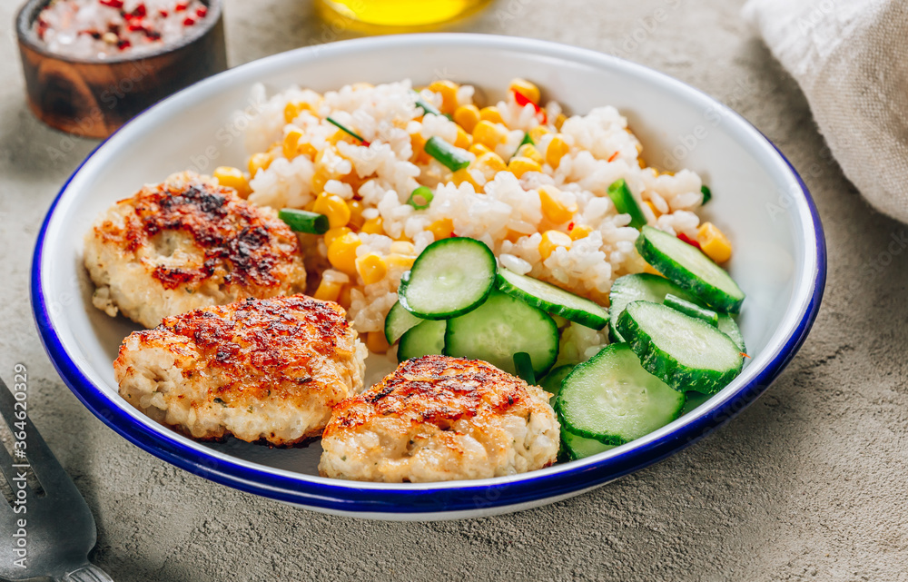 Homemade chicken bowl with rice, corn and cucumber. Healthy balanced eating for lunch. Homemade chicken bowl with rice, corn and cucumber. Healthy balanced eating for lunch.