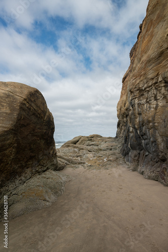 Historic Stagecoach Road at Hug Point at the Oregon Coast. Vertical image.