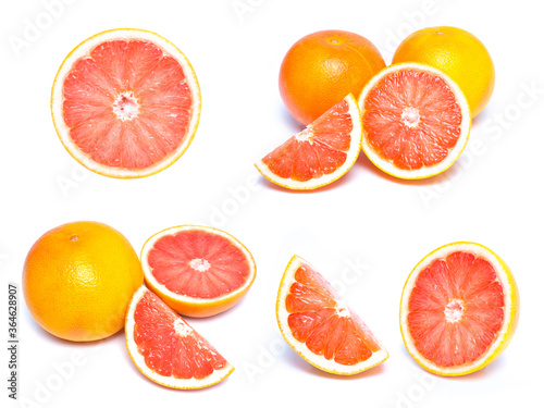 Close up of a sliced fresh grapefruit  Slice of red grapefruit isolated on white background