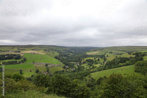 Beautiful scene of Peaks District in central England.  Showing valleys, paddocks, farm land, trees and grass