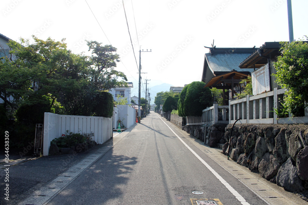 Japanese street, a temple by the roadside around the residential area in Beppu, Japan