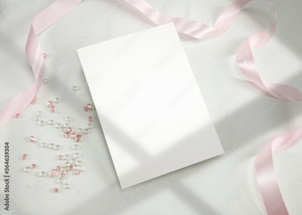 Invitation Mockup. Top view blank card on white background and window shadow with clipping path. - obrazy, fototapety, plakaty 