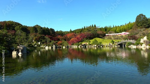 Japanese garden with pond in Hiroshima, Japan. Autumn leaves. 4K photo