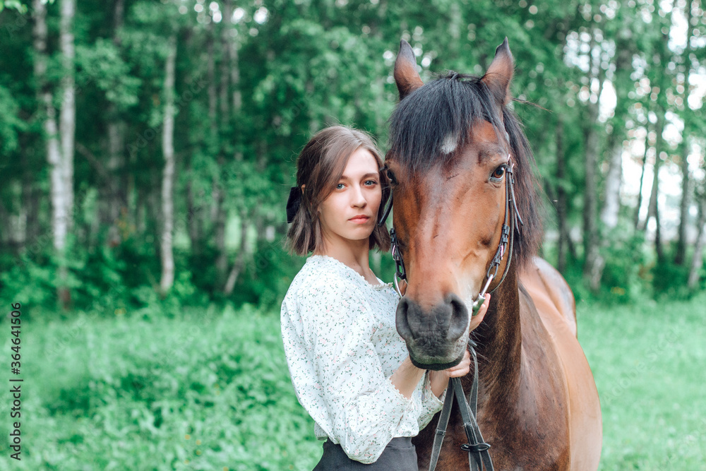 Portrait young woman with horse in forest. Brunette girl and horse Portrait young woman with horse in forest. Brunette girl and horse