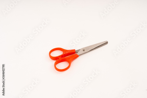 scissor with plastic handle on white background.