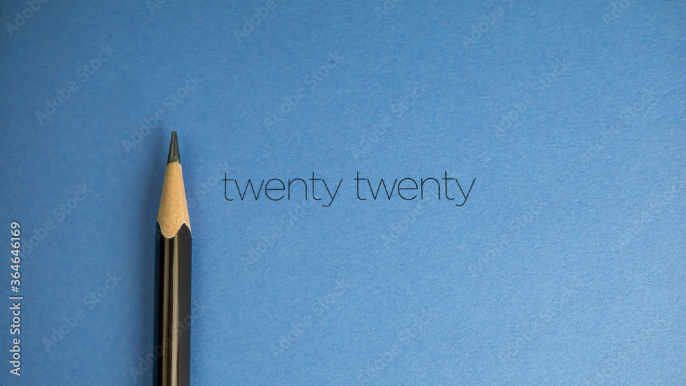 Close up of a pencil with notebook background Close up of a pencil with notebook background