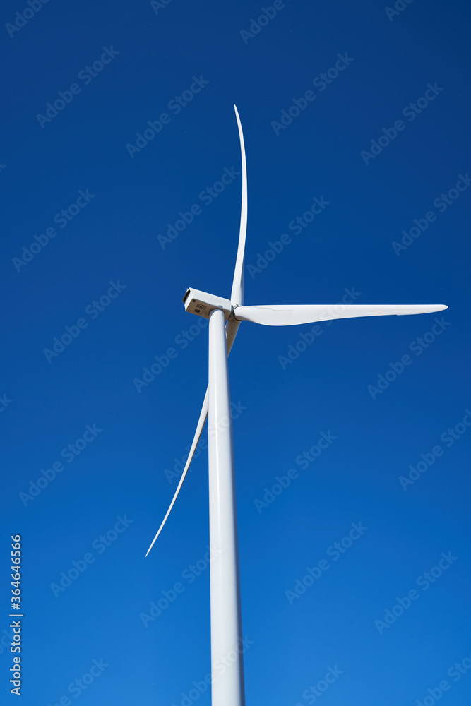 wind generators stand in a field outside the city wind generators stand in a field outside the city