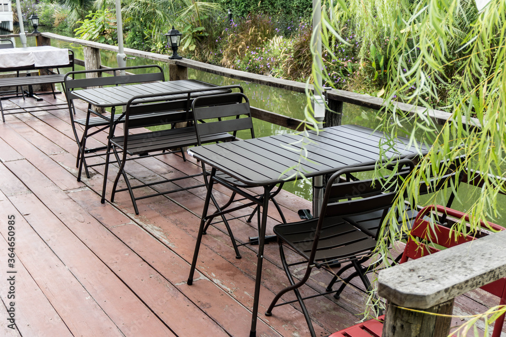Empty table and chair with water terrace with copy space Empty table and chair with water terrace with copy space