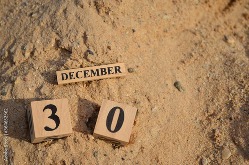 December 30, Number cube with Sand pile for a background.