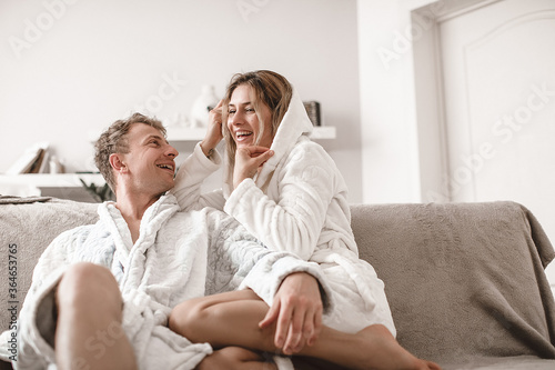 Young couple relaxing on sofa. Love,happiness,people and fun concept.