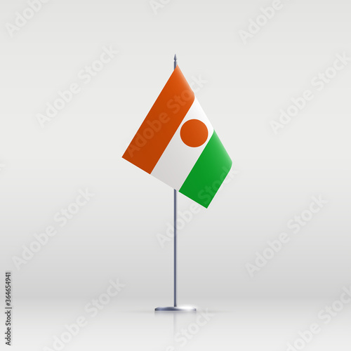 Niger flag state symbol isolated on background national banner. Greeting card National Independence Day of the Republic of the Niger. Illustration banner with realistic state flag.