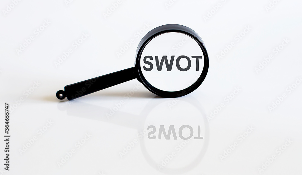 Magnifier with text SWOT on the white background Magnifier with text SWOT on the white background