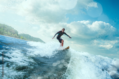 Surfer on Blue Ocean Wave Getting Barreled.  © VIAR PRO studio