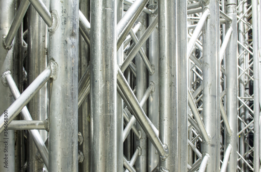 Stack of rigging steel trusses for stage building and installation of professional constructions.