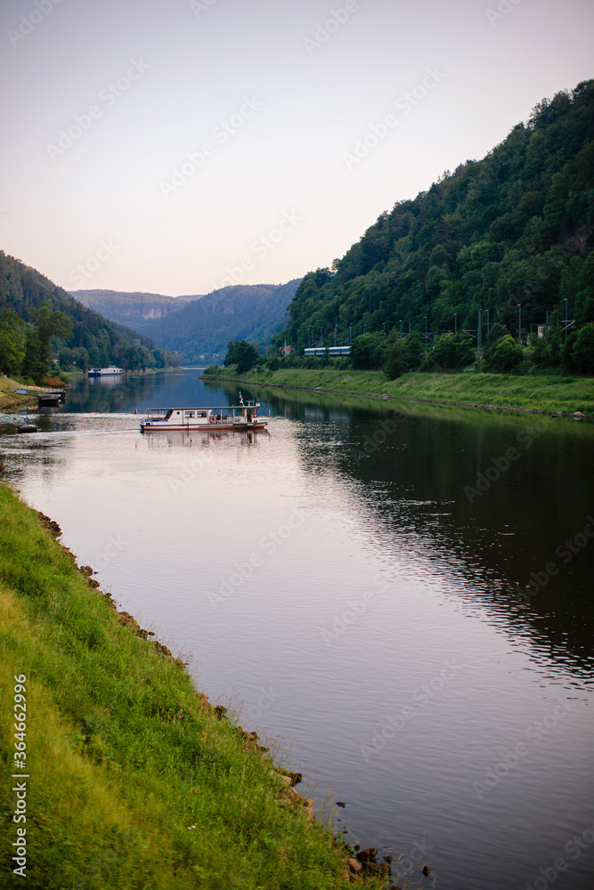 The boat is floating on the river