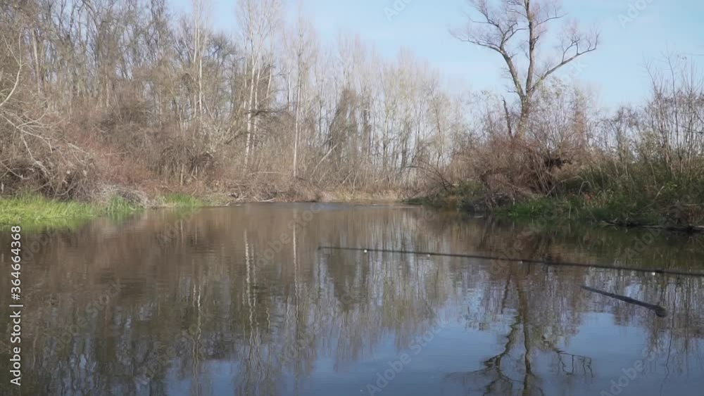 Fisherman is fishing in small river Fisherman is fishing in small river