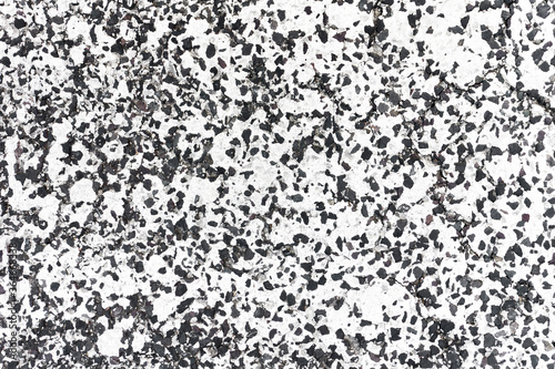 Grunge road texture. Distressed asphalt background. White dry cracked peeling paint. Grain and noise pattern.
