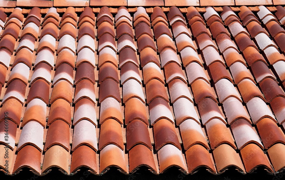 New roof terracotta tiles with different range of brown color. Background and texture