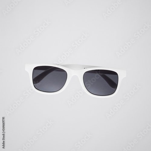 white sun glasses isolated on white/gray background