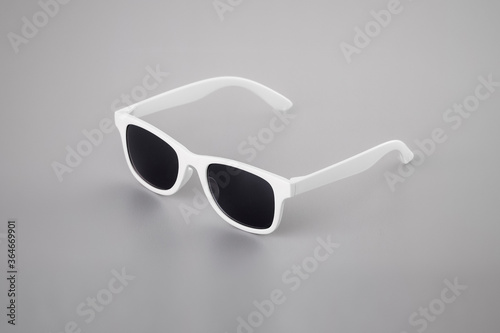 white sun glasses isolated on white/gray background