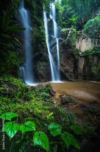 Tropical waterfall in rain forest at Mokfa Waterfall  Chiang Mai in North Thailand.