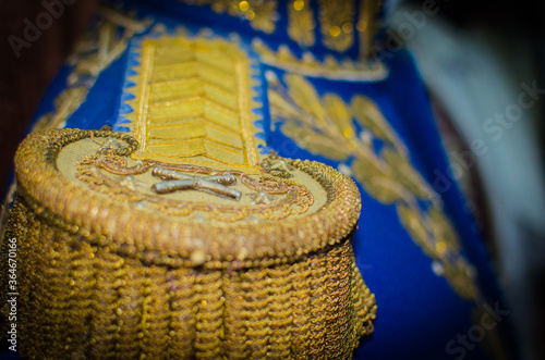 gold epaulettes on a blue tunic