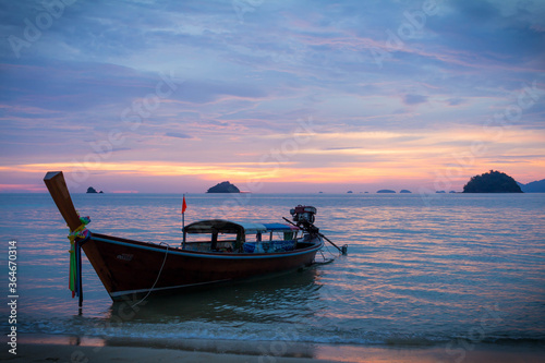 Koh Lipe   Thailand   August 03 2016  Longtail boat at beach on a purple sunset in Koh Lipe  Thailand 