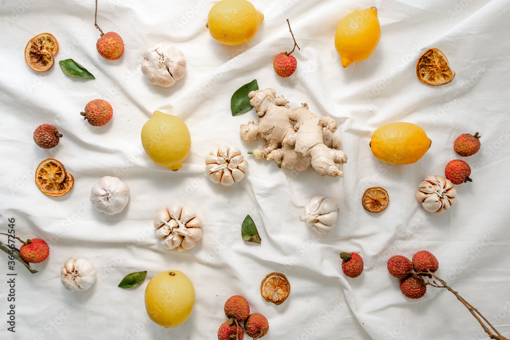 Lemon photographed on a white cloth with several other ornaments. Lemon photographed on a white cloth with several other ornaments.
