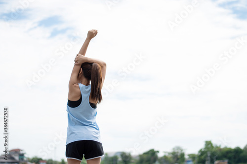 Asian Women Runners, she is warming up in the morning.