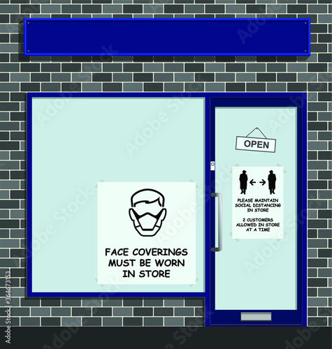 Face coverings to be worn in store sign in shop window following new government guidelines to combat the spread of COVID 19 with blank sign for own text