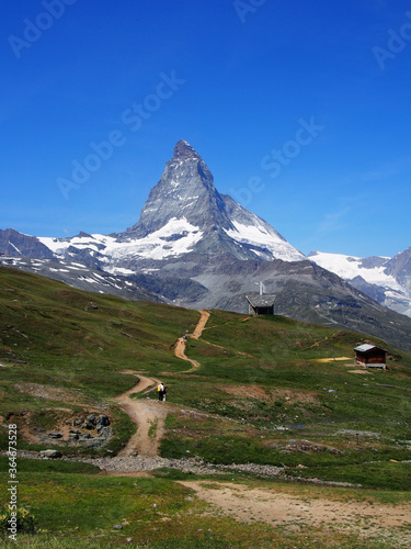 Matterhorn seen from the mountain climbed by the train in Zermatt on a sunny day.