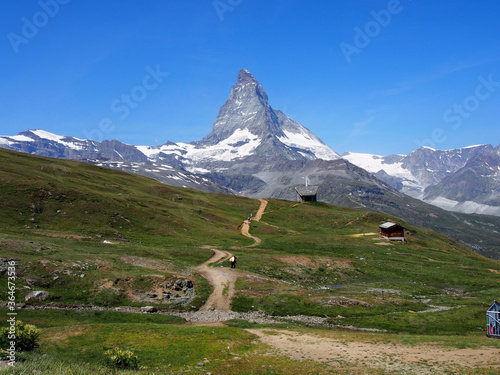 Matterhorn seen from the mountain climbed by the train in Zermatt on a sunny day.