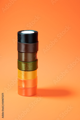 colored packing tape in rolls on colored background