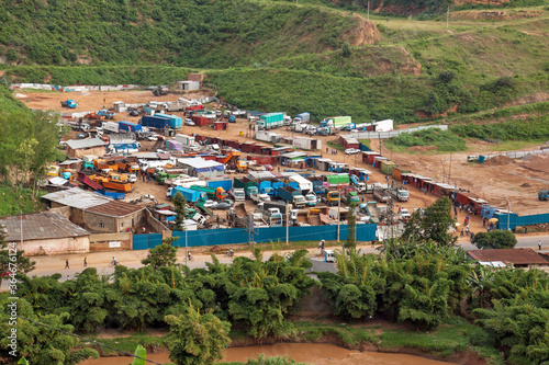 KIGALI, RWANDA: fenced truck park with second hand trucks for sale, along the western outfall road