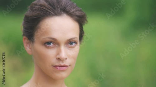 Beautiful woman in the park. Outdoors portrait. Pretty girl face