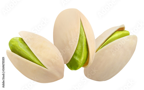 Three delicious pistachios, isolated on white background