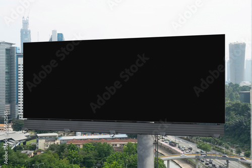 Photography Blank black road billboard with Kuala Lumpur cityscape background at day time