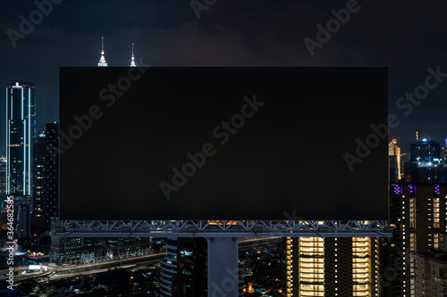 Canvas Print Blank black road billboard with Kuala Lumpur cityscape background at night time