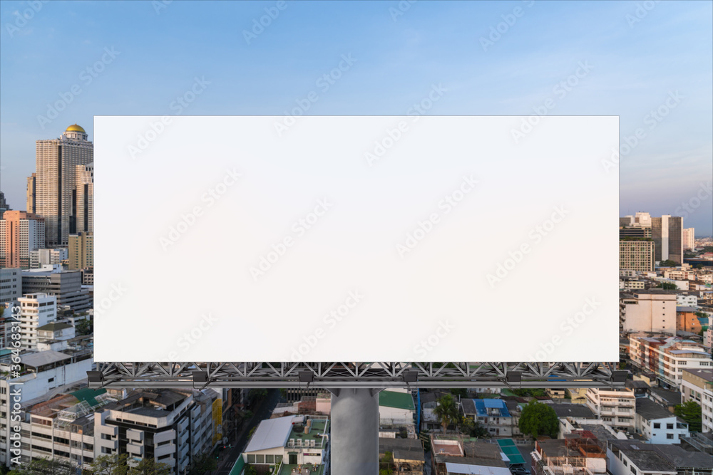 Blank white road billboard with Bangkok cityscape background at sunset. Street advertising poster, mock up, 3D rendering. Front view. The concept of marketing communication to promote or sell idea.