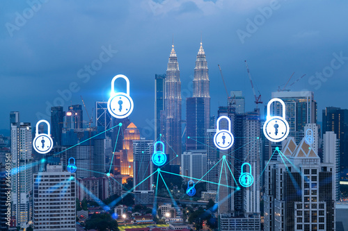 Canvas Print Glowing Padlock hologram, night panoramic city view of Kuala Lumpur, Malaysia, Asia