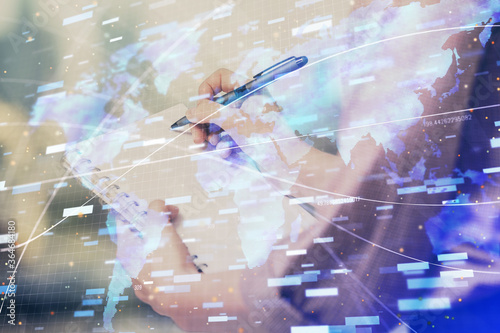 Multi exposure of woman's writing hand on background with data technology hud. Concept of innovation. © peshkova