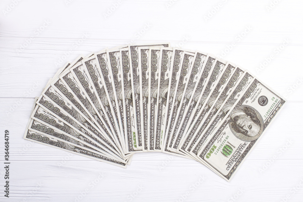 US dollar banknotes fan on white background. Green currency cash notes. Investment concept.