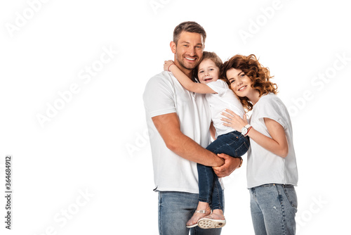 cheerful mother and daughter hugging man isolated on white
