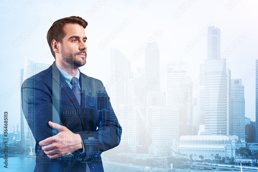 Fototapeta premium Prosperous European entrepreneur in suit in crossed arms pose. Singapore cityscape. The concept of problem solving. Financial downtown. Double exposure.