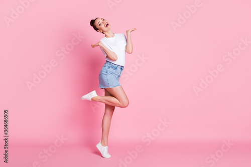 Full length photo of crazy candid girl enjoy rejoice weekend rest relax wear good look clothes isolated over pink color background